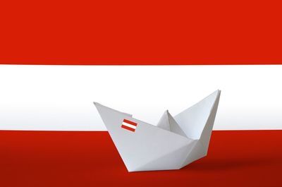 Close-up of paper flag against white background