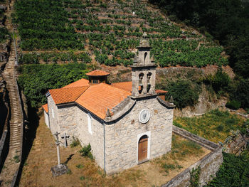 Aerial view of church in vineyard on a hill. belesar in ribeira sacra, ourense, spain