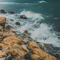 Waves splashing on rocks