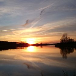 Scenic view of sunset over lake