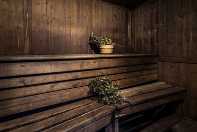 Wilted bouquets on wooden bench