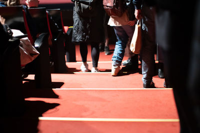 Low section of people walking on stage