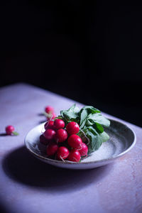 Close-up of strawberries in plate on table