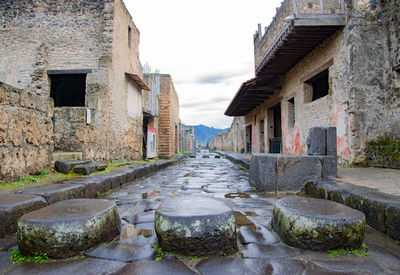 Street amidst buildings against sky