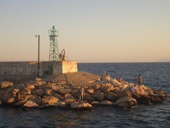 Scenic view of sea against sky at sunset