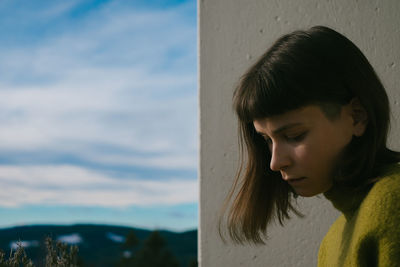 Close-up of woman against sky