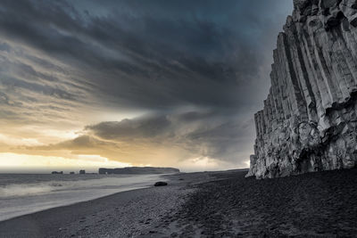 Scenic lightning over seascape at black sand reynisfjara beach during night