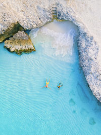 High angle view of man swimming in sea