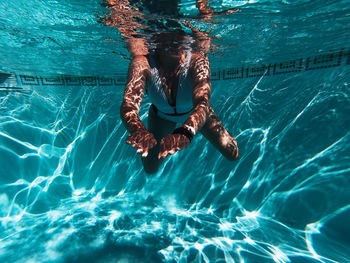 Woman swimming in pool