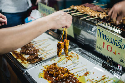 Midsection of person preparing food on table