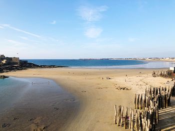 Scenic view of beach against sky