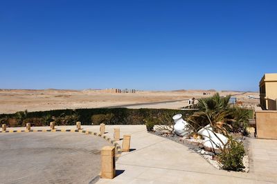 Scenic view of landscape against clear blue sky