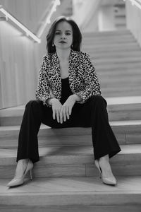 Young woman sitting on floor