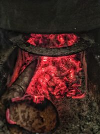 High angle view of red chili peppers on barbecue grill