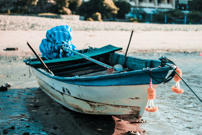 Fishing boat moored on beach