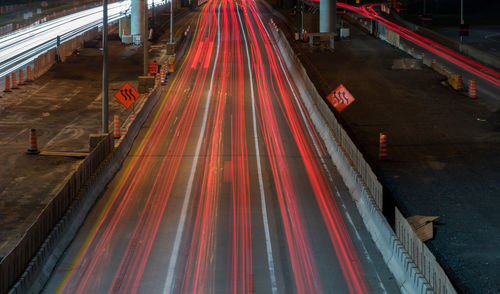 High angle view of light trails on road at night