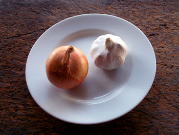High angle view of fruits in plate on table