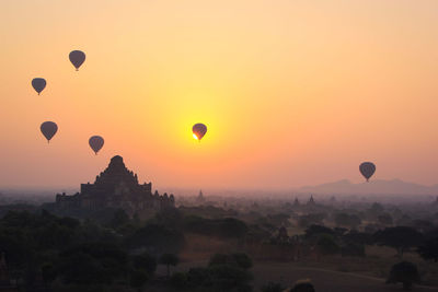 View of hot air balloons against sky during sunset