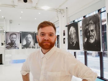 Portrait of man standing in corridor