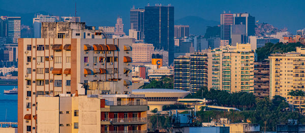 Buildings in city against sky