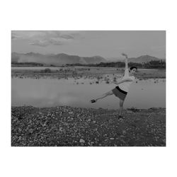 Woman on beach against sky