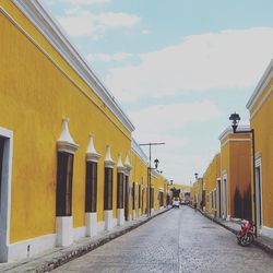 Empty walkway along buildings