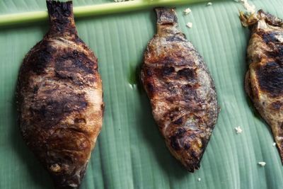 High angle view of meat on barbecue grill