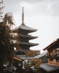 View of pagoda against sky in city