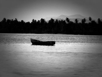 Boat in lake against sky