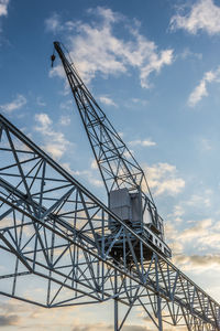 Low angle view of crane in copenhagen against sky
