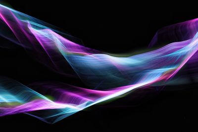 Close-up of light trails against black background