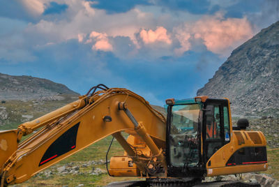 View of construction site against mountain range