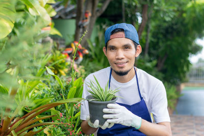 Portrait of smiling young man standing outdoors