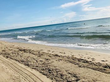 Scenic view of beach against sky