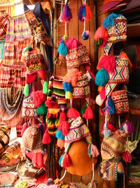 Colorful decorations hanging for sale at market stall