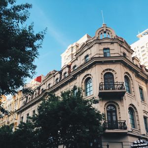 Low angle view of building against blue sky