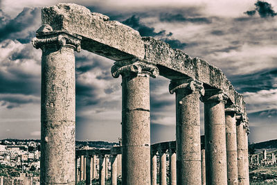 Low angle view of old ruins against sky