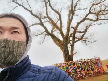 Portrait of young man covered with snow