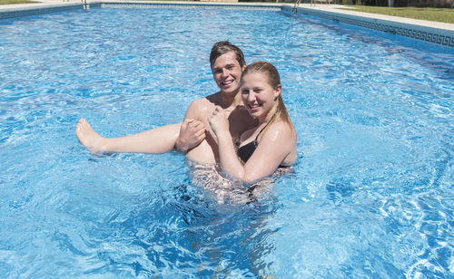 Portrait of woman swimming in pool