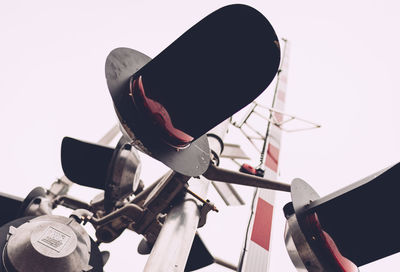 Low angle view of bicycle wheel against clear sky