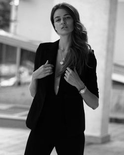 Young woman showing cleavage while standing outdoors