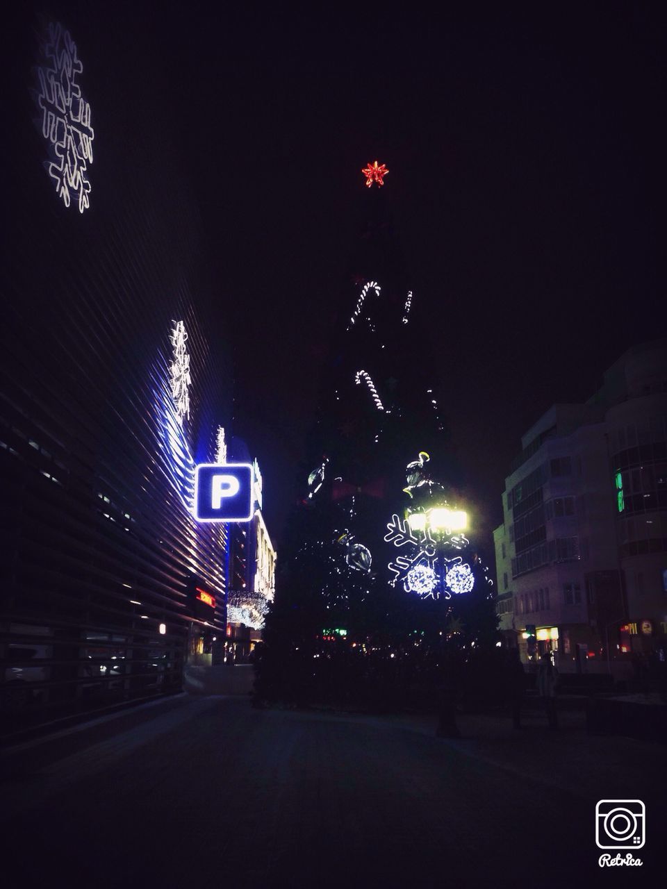 illuminated, night, text, communication, western script, building exterior, city, street, architecture, transportation, road, built structure, road sign, information sign, directional sign, guidance, car, sign, city street, arrow symbol