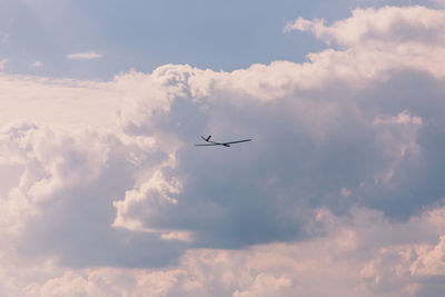 Low angle view of airplane flying in sky