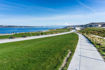 Scenic view of beach against blue sky