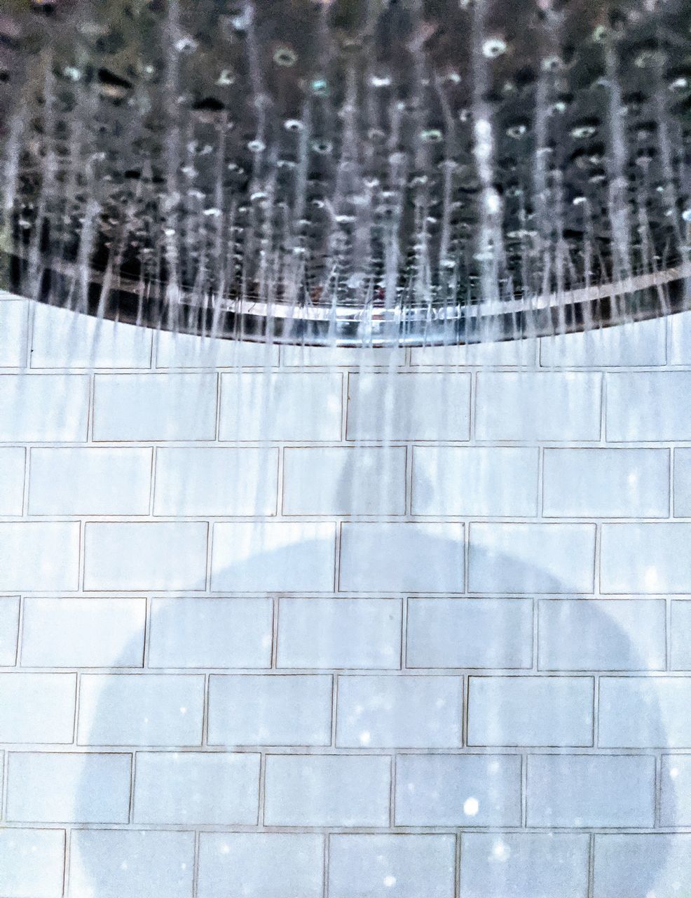 FULL FRAME SHOT OF TILED WALL WITH WINDOW