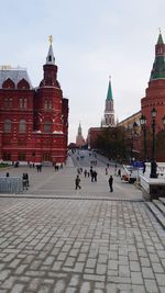 Group of people in front of buildings in city