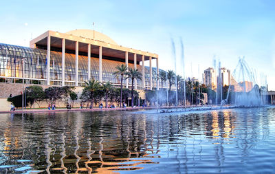 Reflection of buildings in swimming pool