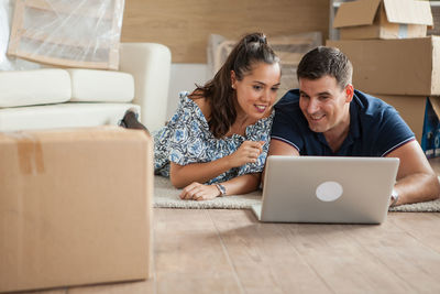 Young woman using laptop at home