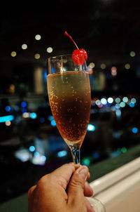 Close-up of hand holding glass of wine