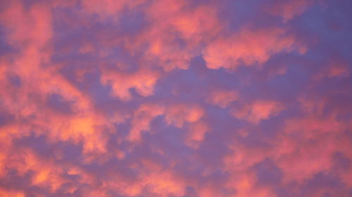 Low angle view of dramatic sky during sunset